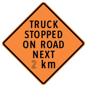 truck stopped on road next ( x ) km