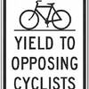 yield to opposing cyclists