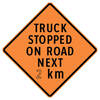 truck stopped on road next ( x ) km