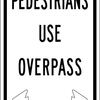 pedestrians use overpass with arrows