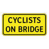 cyclists on bridge tab